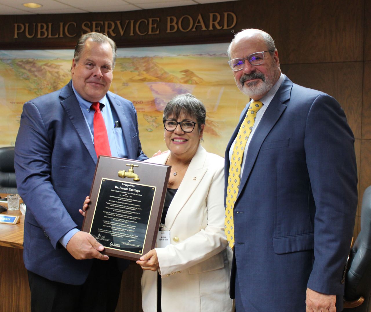 Outgoing Public Service Board Chair, Dr. Ivonne Santiago (middle), was recognized by Chief Executive Officer John Balliew and El Paso Mayor Oscar Leeser during her last meeting, July 10. 