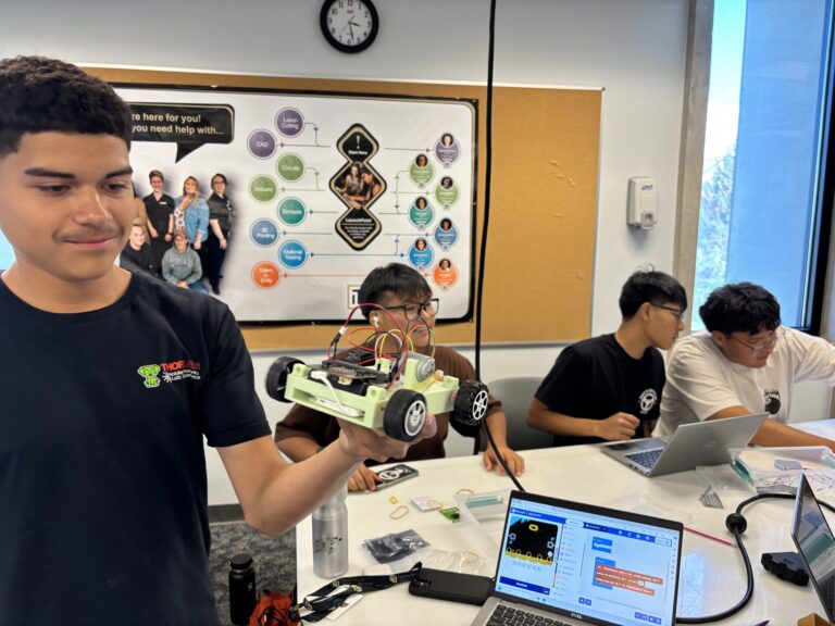 Students working on their EV MicroKarts at the CU Engineering Camp.