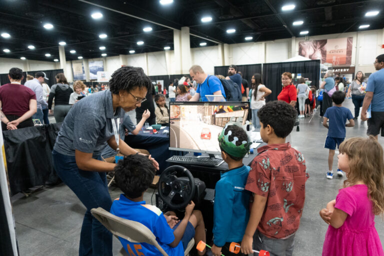Fawn Groves explains the CARLA simulator to students.